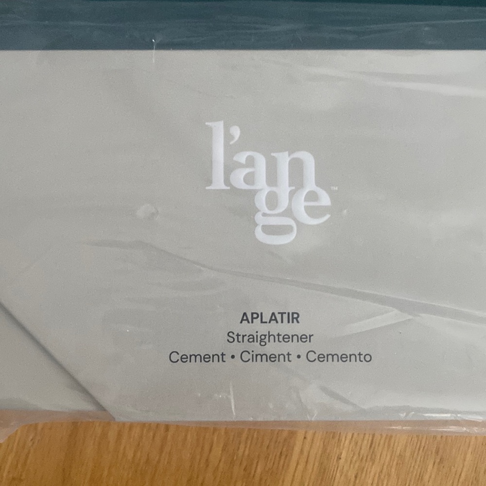 Tourmaline infused ceramic straightener. New in packaging.